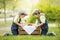 Two beautiful children, boy brothers, eating strawberries and co