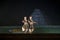 Two Beautiful Classical Odissi or orissi dancer performing in stage at Konark Temple, Odisha, India.