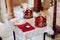 Two beautiful crowns with gold and red cloth stand on a table in the church before the baptism of the baby