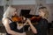 Two beautiful female violinists playing violin