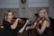 Two beautiful female violinists playing violin