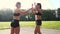 Two beautiful fitness girls doing hand shakes ritual