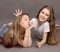 Two beautiful, funny friends, 9 years old, on a photo shoot in the studio