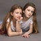 Two beautiful, funny friends, 9 years old, on a photo shoot in the studio