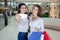 Two beautiful girls makes selfie in a shopping centre