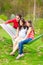 Two beautiful girls and a young man in hammock