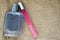 Two beautiful glass shiny fashion glamorous cologne vials, perfume pink slim and blue rectangular with little beads space for a si