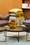 Two beautiful glossy glass golden vases - perfect luxirious interior design elements. Stylish interior art deco