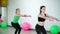 Two beautiful sport woman doing fitness exercise