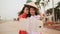 Two beautiful Vietnamese girl doing selfie with phone in national dresses Ao Dai