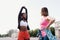 Two beautiful women stretching in city square after running and sport activity