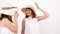 Two beautiful women wearing large summer hats