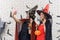 Two beautiful young asian woman wearing witch costume holding pumpkin Jack O Lantern taking selfie photo on mobile phone