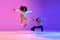 Two beautiful young girls dancing hip-hop on gradient pink purple neon studio background