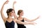 Two beautiful young girls making exercise or dancing together