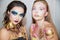 Two beautiful young women with creative make-up
