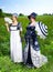 Two beautiful young women dressed in Victorian Regency Jane Austen style fashion dresses