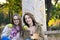 Two beautiful young women holding green apples and smiling