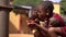 Two beautifully Dressed Little African Girls Sipping Water From a Tap