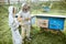 Two beekeepers working on the apiary