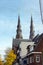 Two belfries of the Catholic Church of St. Catherine, Eindhoven, Netherlands. Golden Autumn in Eindhoven