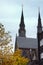 Two belfries of the Catholic Church of St. Catherine, Eindhoven, Netherlands. Golden Autumn in Eindhoven