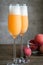 Two bellini cocktails with fresh peaches