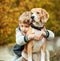 Two best freinds portrait - little boy hugs beagle dog