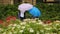 Two best friends spending free time in park with colorful umbrellas, childhood