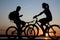 Two bicycler on sunset