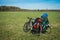 Two bicycles with luggage on meadow in Kaluga region, Russia