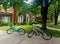 Two bicycles parked in front of upscale traditional home