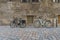 Two Bicycles Standing on an Old Brick Wall