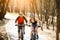 Two bicyclists ride on road