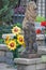 Two Big Cat Lion Sculptures in Garden with Sunflowers