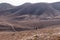 Two bikers on a mountain bike trail from city Arad to the Dead Sea, Judaean Desert, Israel.