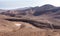 Two bikers on a mountain bike trail from city Arad to the Dead Sea, Judaean Desert, Israel.