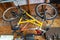 Two bikes hanging from the ceiling in a garage, for winter storage