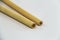 Two Biodegradable Bamboo Straws on a white background. Environmentally Friendly Alternative to Plastic. Close Up