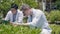 Two Biotechnology man engineer hold magnifying glass and looking at vegetables leaf in hydroponics