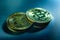 Two bitcoin coins isolated on technological blue background
