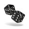 Two black falling dice isolated on white.