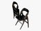 Two black folding chair 3d rendering on a white background