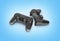 Two black gamepads isolated on blue gradient background 3d rendering