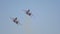 Two black military fighter jets flying in the sky