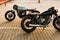 Two black and silver vintage custom motorcycles cafe racers