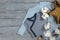 Two blue babies bodysuits on gray wooden background. Shopping ma