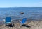 Two blue chairs at the beach