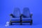 Two blue cinema chairs on blue