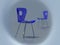 Two blue designer\'s chairs